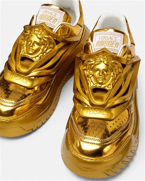 versace golden shoes|gold Versace sneakers.